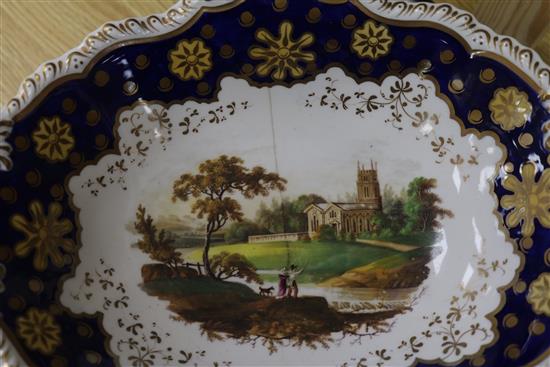 A Staffordshire dessert service, decorated in cobalt blue and gilt and painted topographical scenes